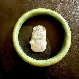 Genuine jade 62-63mm bangle and lighter green monkey pendant .